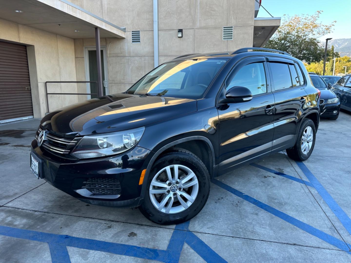 2016 Black /Black Volkswagen Tiguan (WVGAV7AX5GW) , AUTOMATIC transmission, located at 30 S. Berkeley Avenue, Pasadena, CA, 91107, (626) 248-7567, 34.145447, -118.109398 - Crown City Motors is a used “Buy Here Pay Here” car dealer in Pasadena CA. “Buy Here Pay Here” financing, means that when you purchase your vehicle from our dealership, that you make the payments to the dealership as well. We do not need the banks approval to get you approved for a used auto - Photo#0